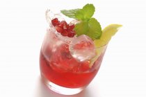 Closeup view of pomegranate drink with mint and lemon — Stock Photo