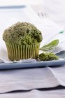 Spinach muffin on plate — Stock Photo