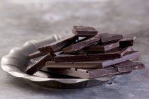 Broken bars of dark chocolate — Stock Photo