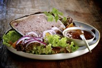 Duck with salad and sauce — Stock Photo