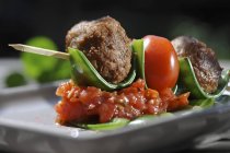 Meatballs with tomatoes on sticks — Stock Photo