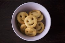 Closeup top view of potato smileys in a bowl — Stock Photo