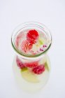 Carafe of raspberry and lime lemonade — Stock Photo