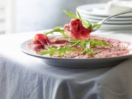 Beef carpaccio with pepper — Stock Photo