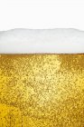 Glass of lager with sparkles — Stock Photo