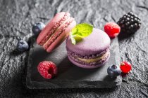 Macaroons with various berries — Stock Photo