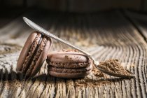 Chocolate macaroons with spoon — Stock Photo