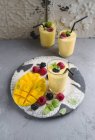 Mango and berry smoothies — Stock Photo