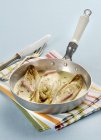 Braised chicory in a white wine sauce — Stock Photo