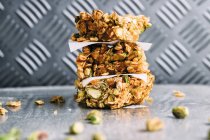 Stack of muesli bars with pistachio — Stock Photo