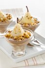 Pere alla crema - pears in hazelnut cream in bowls over tray — Stock Photo