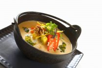 Chicken and peanut soup with peppers — Stock Photo