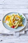 Fusilli pasta with colourful vegetables — Stock Photo