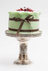Wedding cake on silver cake stand — Stock Photo