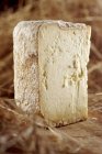 Hard cheese  on wooden surface — Stock Photo