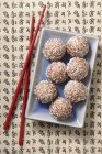 Top view of coconut balls with grated coconut — Stock Photo