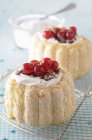 Charlottes with cream and redcurrants — Stock Photo