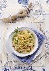 Conchiglie shell pasta with fish tartare — Stock Photo