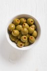 Spanish olives filled with peppers — Stock Photo