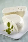 Cheese on white platter — Stock Photo