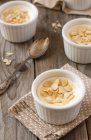 Milk pudding with almonds in bowls — Stock Photo