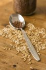Oat seeds on wooden surface — Stock Photo