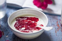 Yogurt with strawberry sauce — Stock Photo