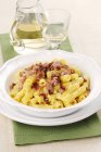 Rigatoni pasta with cream and ham — Stock Photo