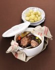 Elevated view of Manzo al cucchiaio with braised beef and spices — Stock Photo