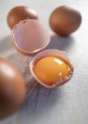 Raw egg yolk in eggshell — Stock Photo