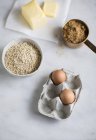 Baking ingredients on white surface — Stock Photo