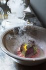 Beetroot on quark pure being made  in bowl with steam — Stock Photo
