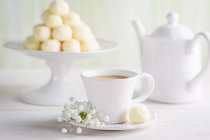 Coconut pralines with coffee — Stock Photo