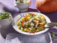 Penne pasta with pumpkin and feta cheese — Stock Photo