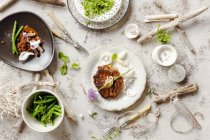 Top view of seafood dishes on table decorated with driftwood — Stock Photo