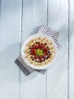 Muesli with apples, grapes and almonds — Stock Photo