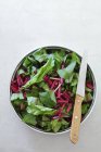 Fresh beetroot leaves in bowl — Stock Photo