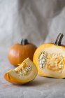 Pumpkins on white surface — Stock Photo
