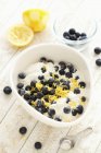 Closeup view of scone mix with blueberries and lemon zest — Stock Photo