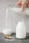 Coconut milk in bottle — Stock Photo