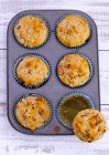 Baked Muffins in muffin tin — Stock Photo