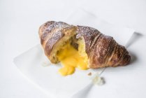 Croissant filled with salted egg yolk — Stock Photo