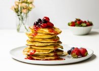 Pile of pancakes with berries — Stock Photo