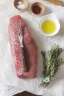 Raw beef steak with spices — Stock Photo