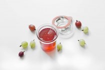 Gooseberry jelly served in glass jar — Stock Photo