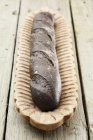 Baguette coloured with squid ink — Stock Photo