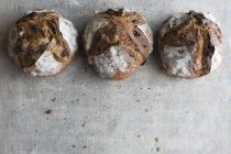 Three loaves of crusty bread — Stock Photo