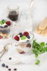 Tiramisu with berries in jars — Stock Photo