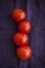 Vier rote Tomaten — Stockfoto