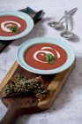 Tomato soup with basil and creme frache — Stock Photo